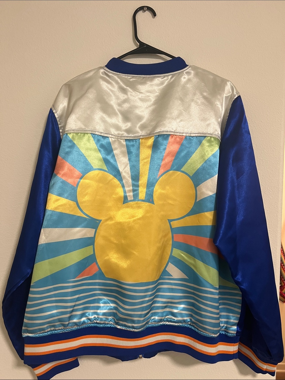 Disney Satin Jacket with Yellow Mickey Sunburst on Blue, new without tags.